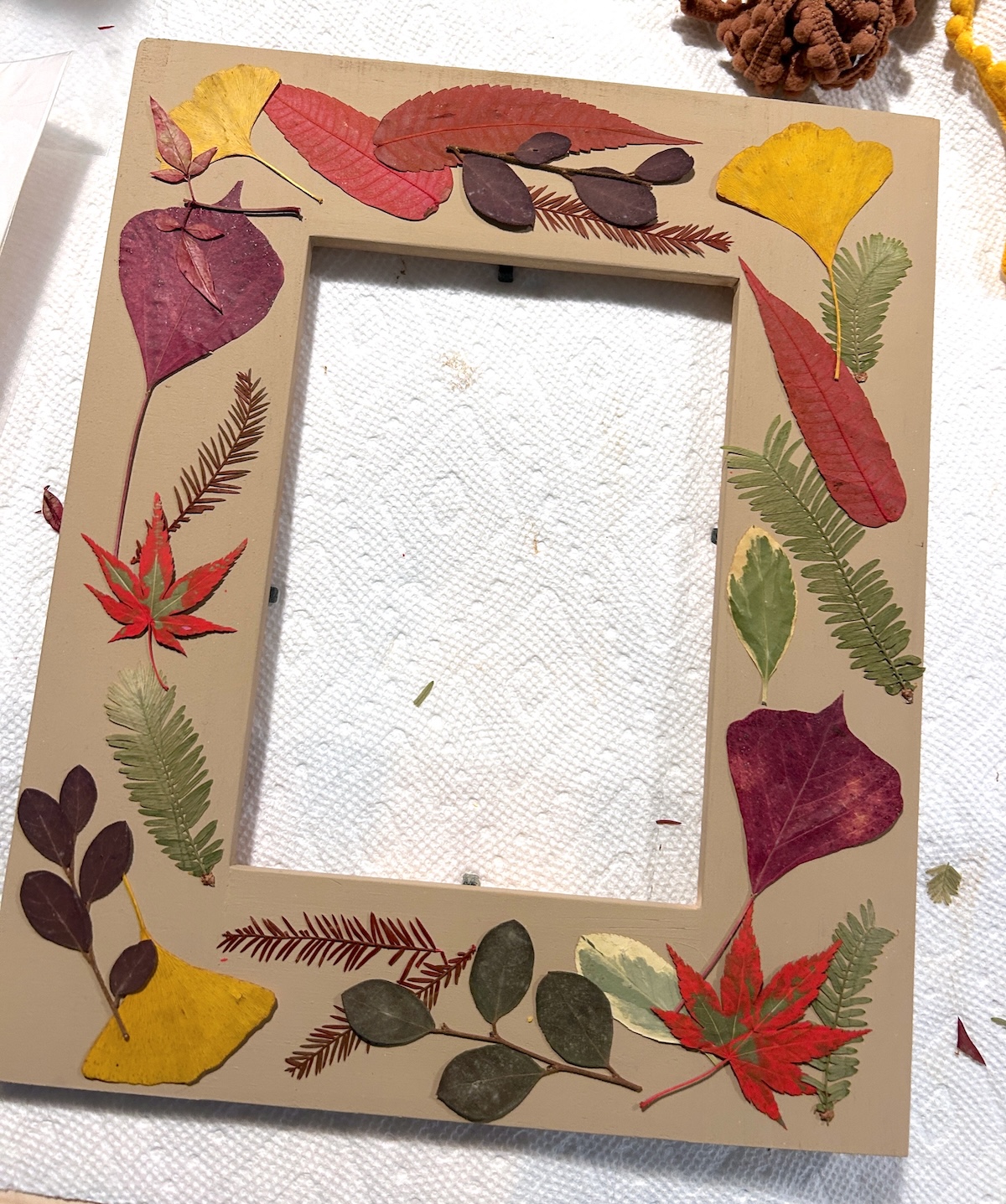 Leaves laid out on the painted frame
