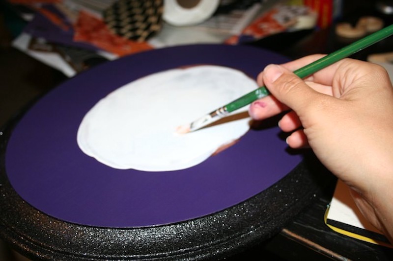 Paint the center of your Halloween wall decor with white craft paint