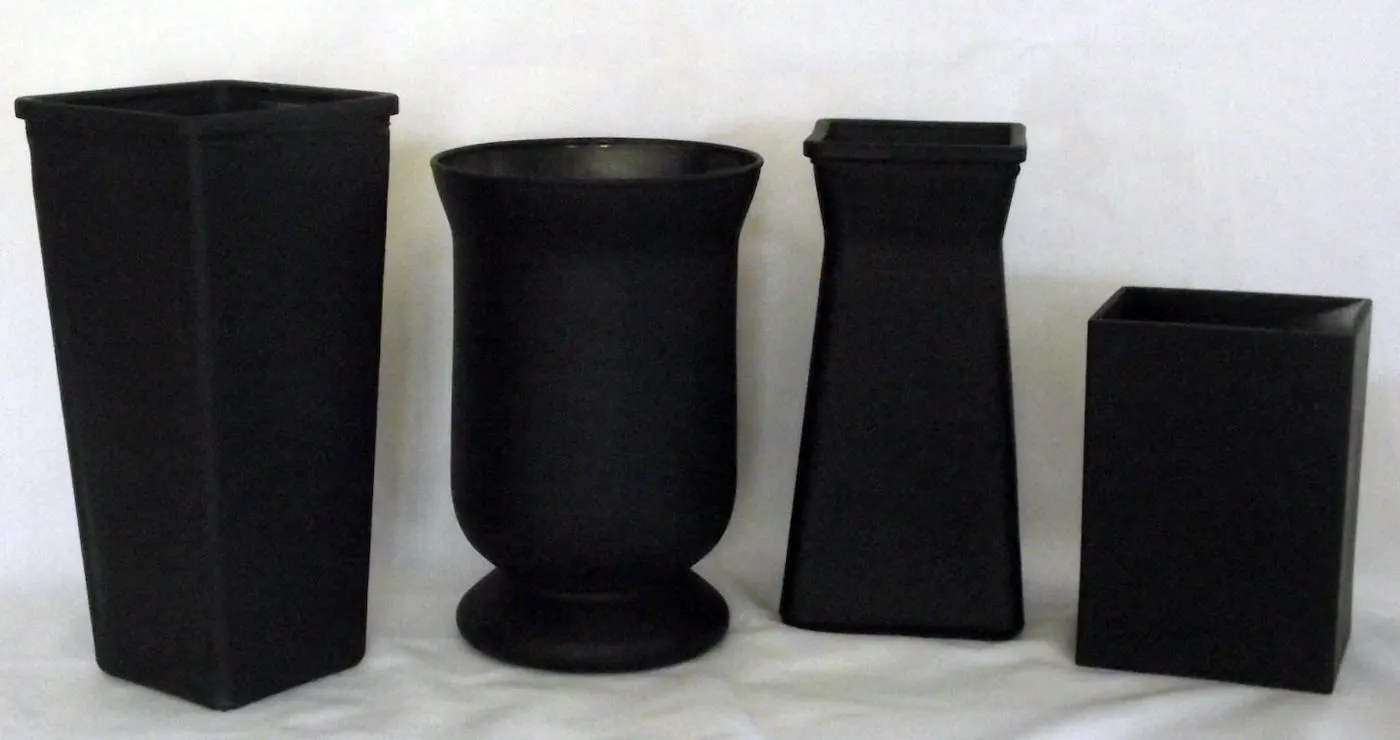 Four glass vases spray painted black