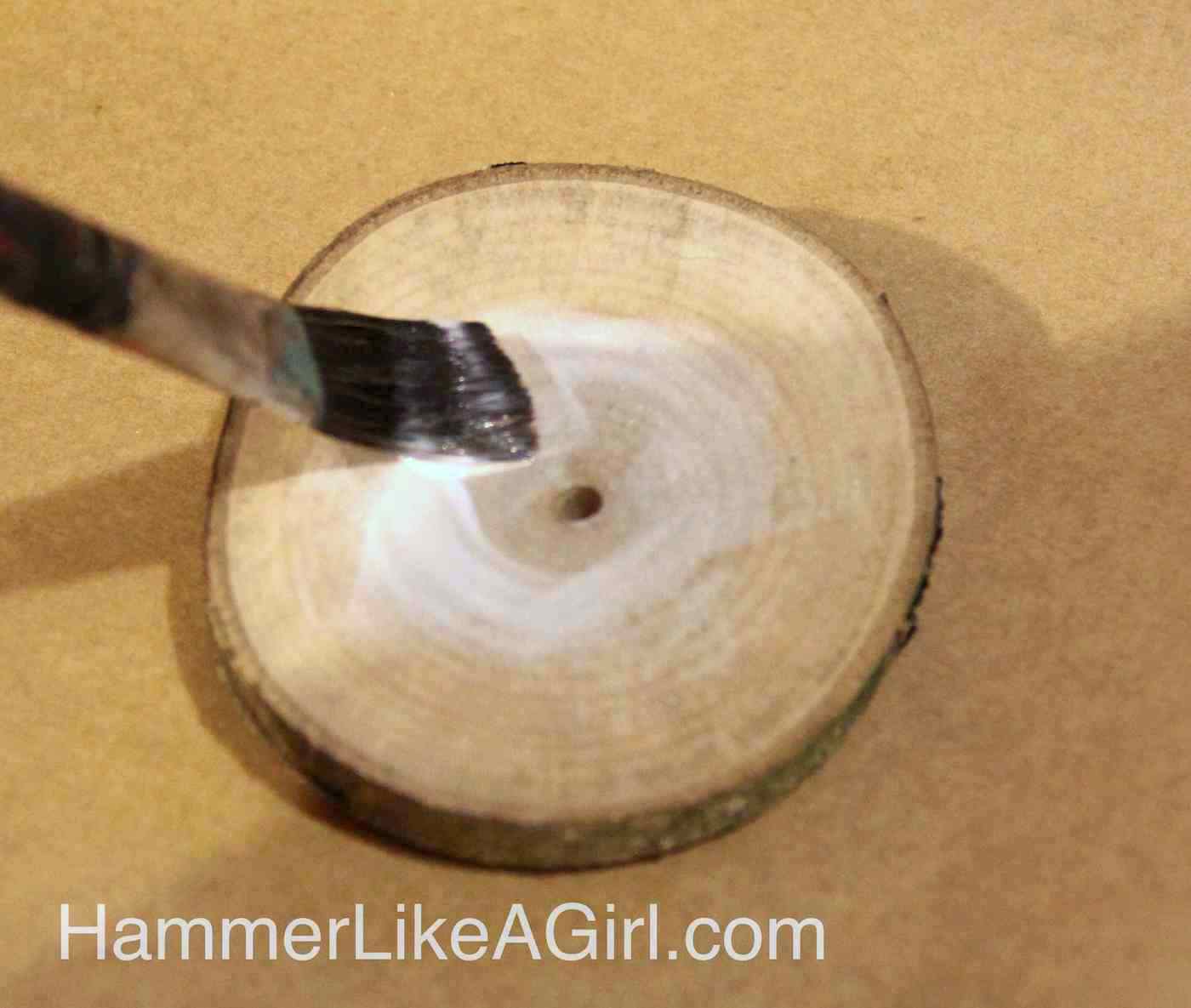 Mod Podge ephemera to a wood slice