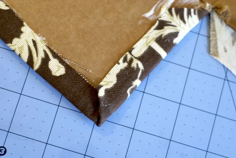 Fabric folded on the edges of the box