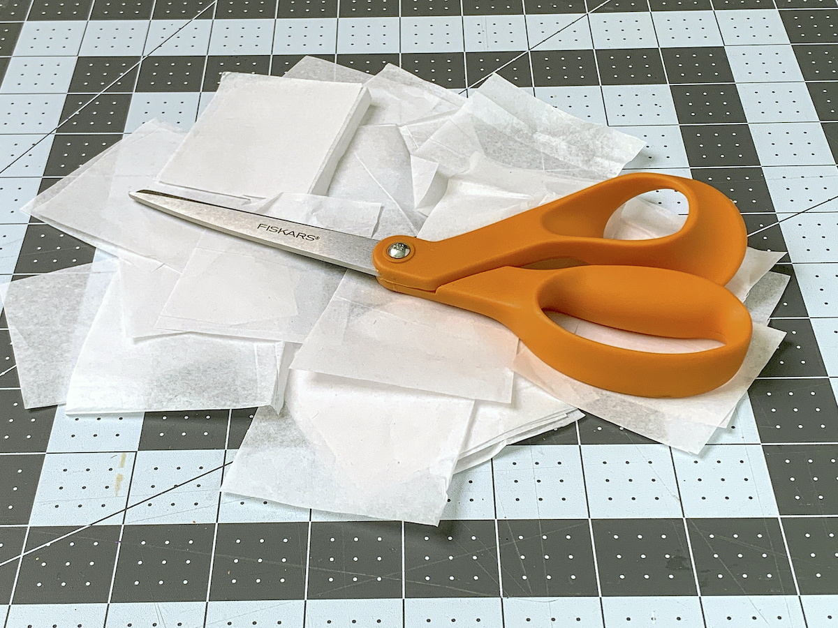 Cut pieces of tissue paper with scissors on top