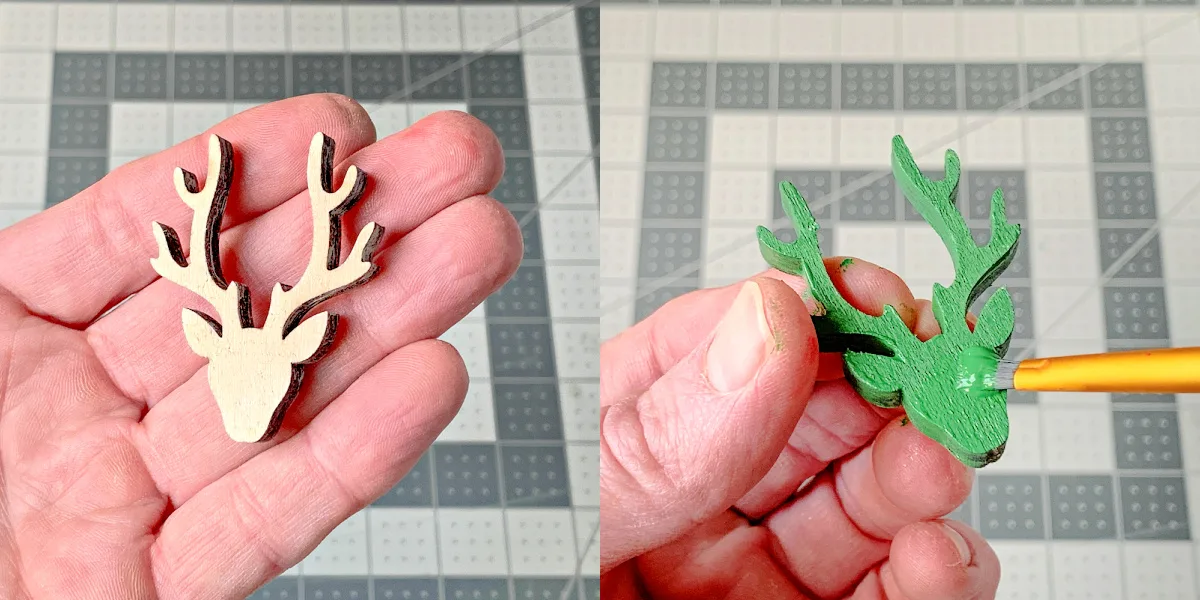 Painting a wood deer shape with green acrylic paint