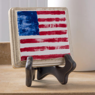 Finger painted American flag on a wood plaque