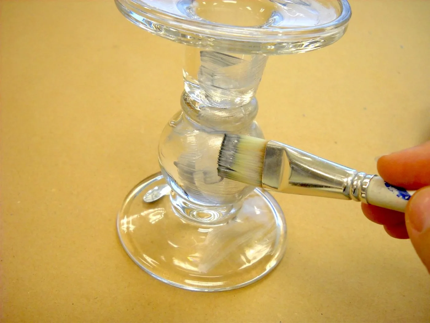 Painting the candle stick with glass paint