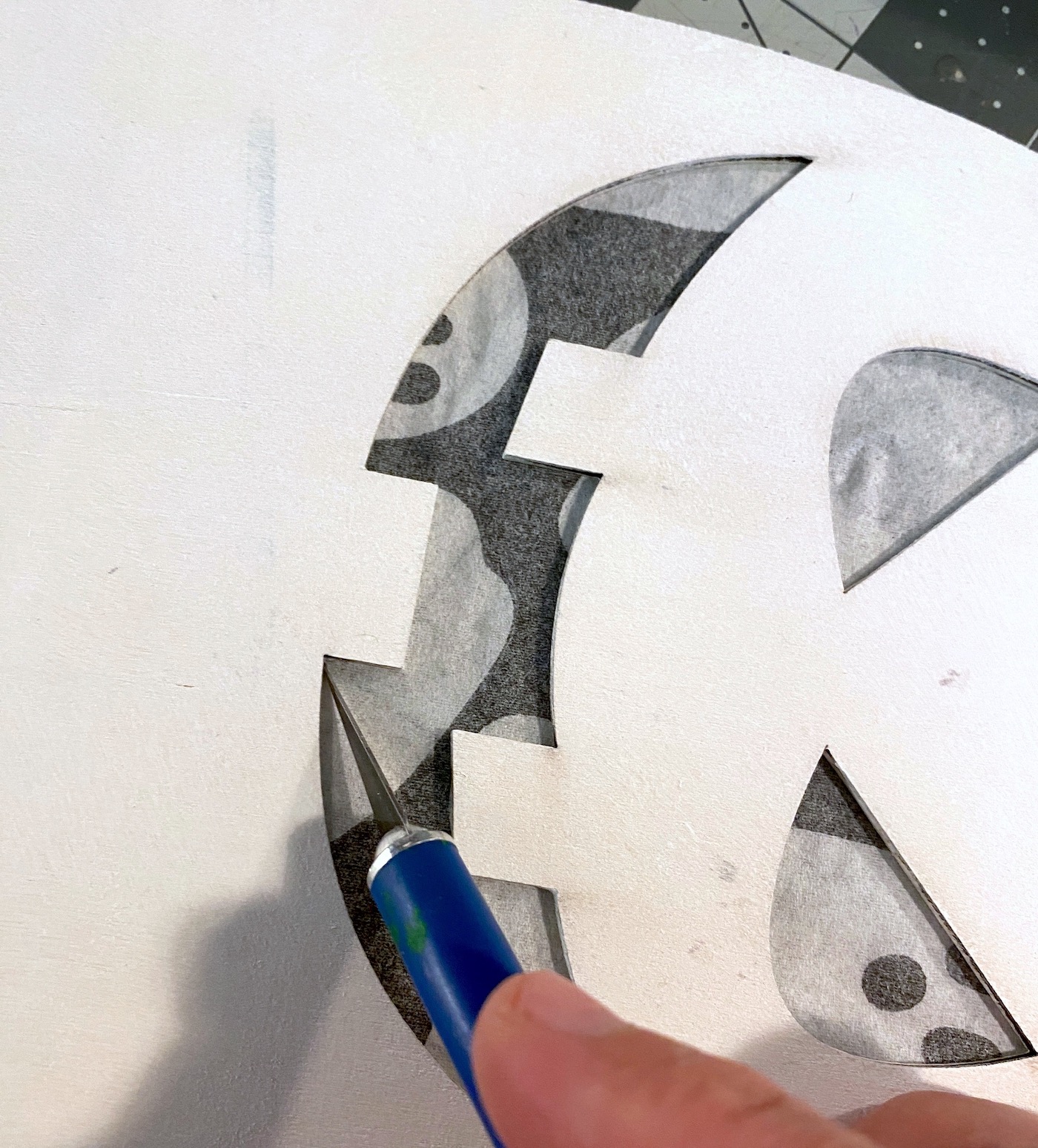 Cutting the ghost mouth out with a craft knife