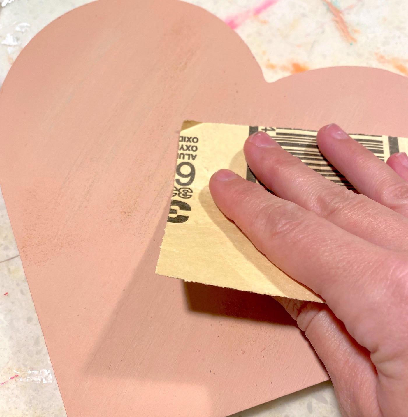 Distress the heart with sandpaper