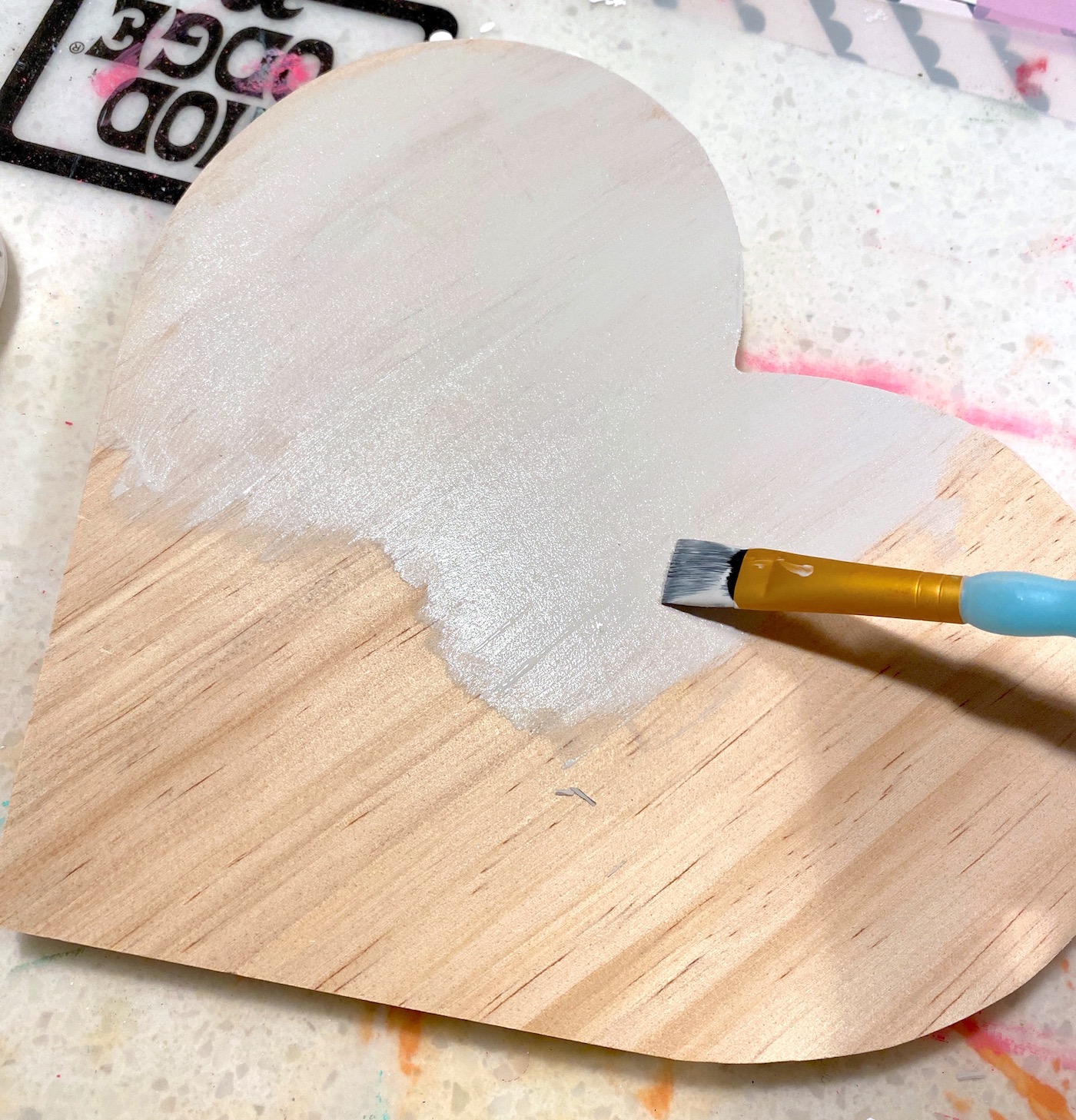 Painting the heart with light grayish brown paint