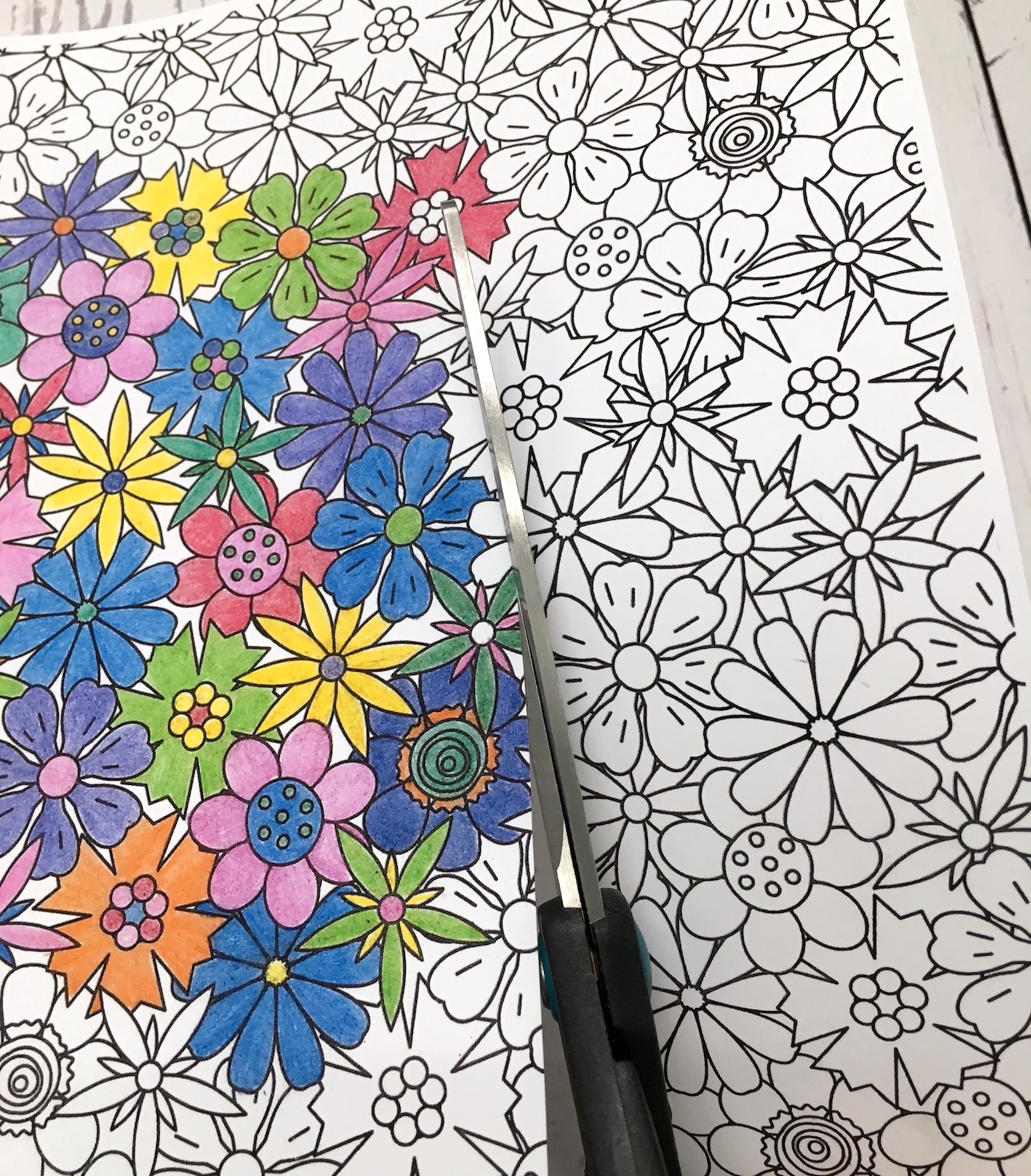 Cutting out the coloring page with scissors