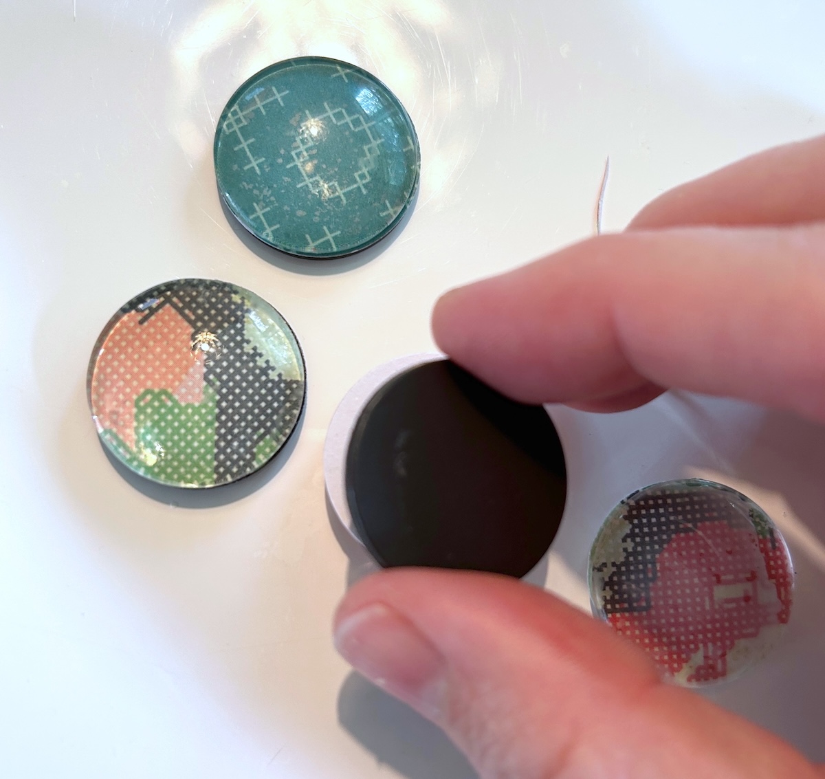 attaching magnets to the back
