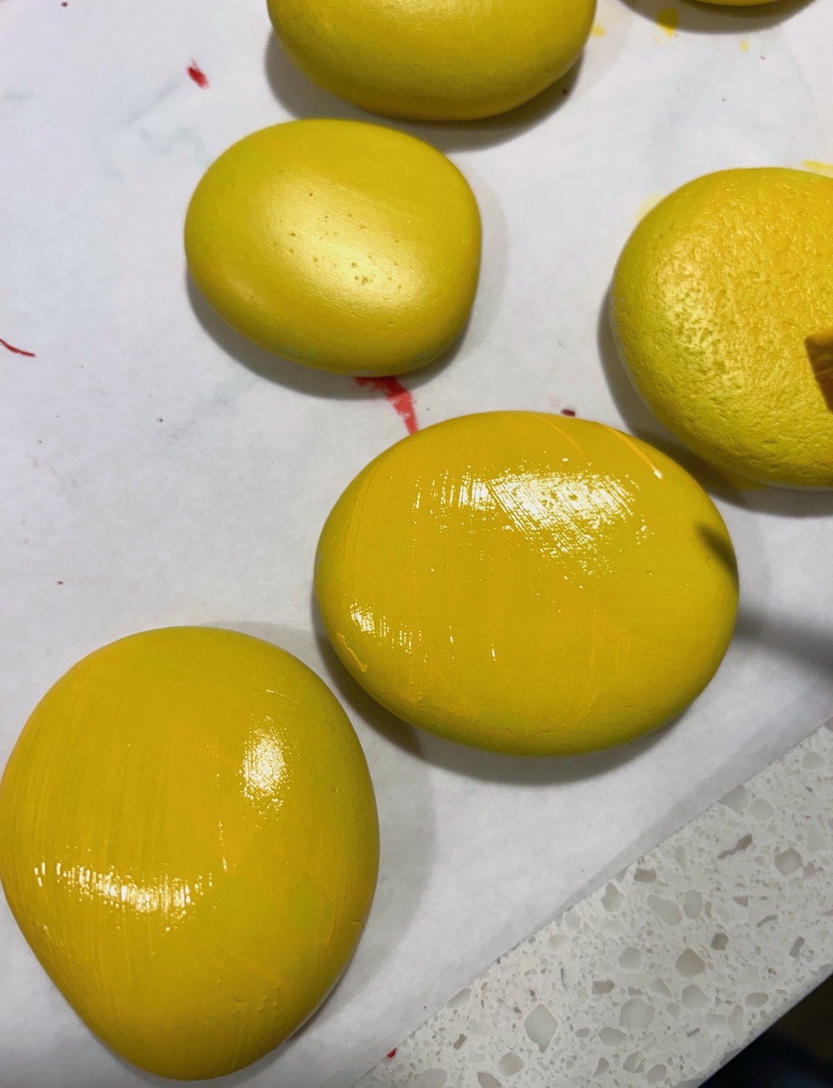 Painting hte other side of the rocks with yellow
