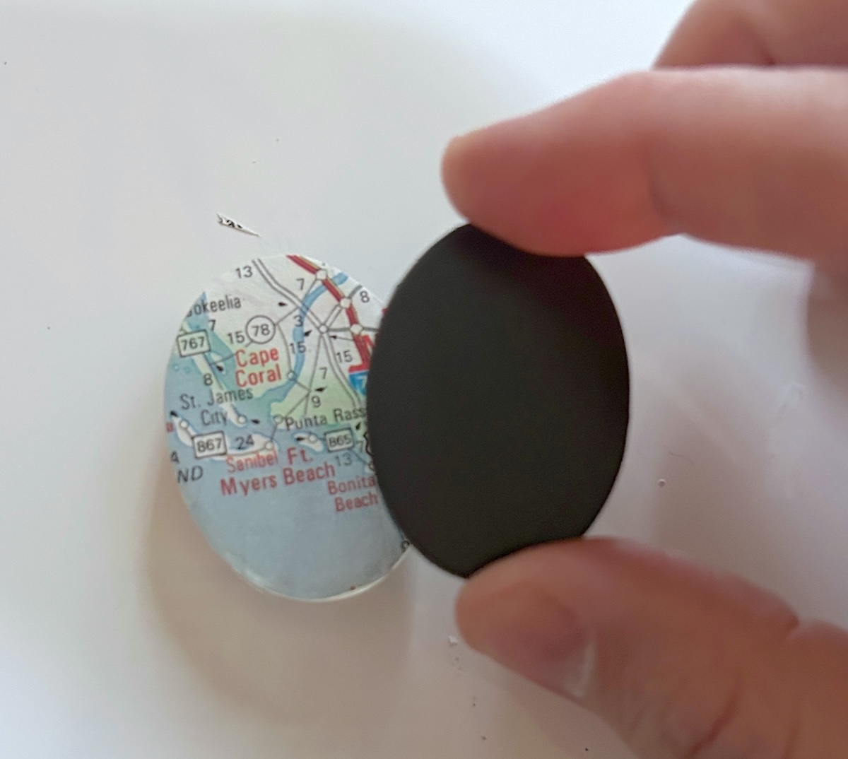 placing the magnet on the back of the glass dome