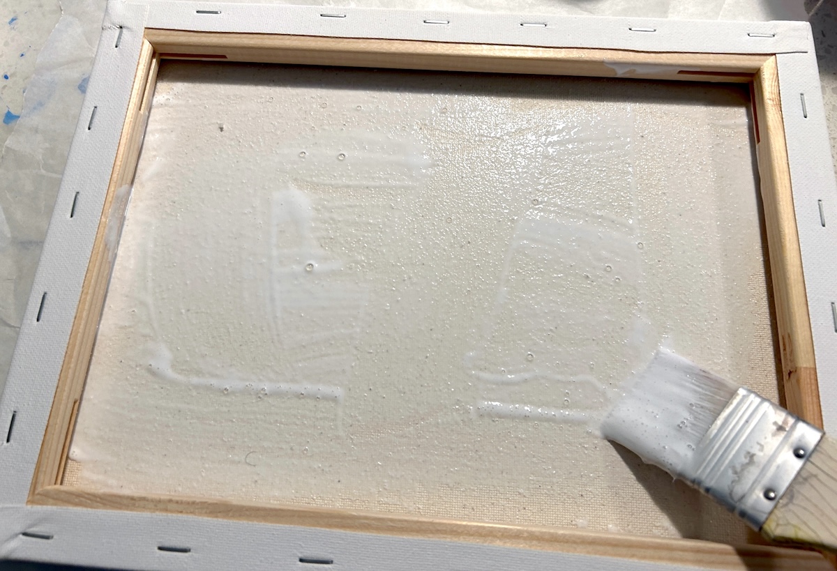 adding Mod Podge to the inside of a canvas