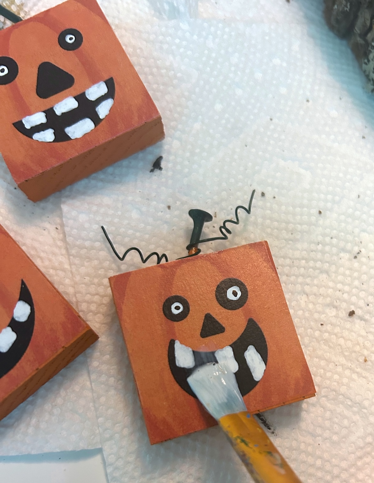 sealing the pumpkin with mod podge